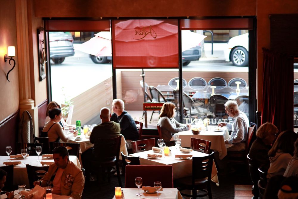Guests dining by the front windows