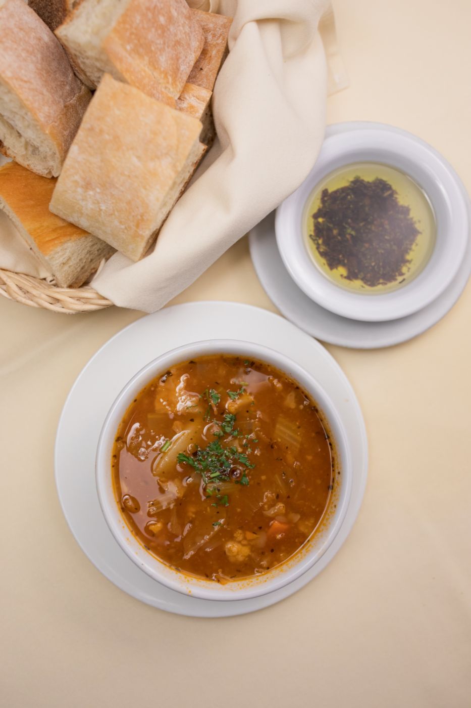 Minestrone soup with bread and herb oil