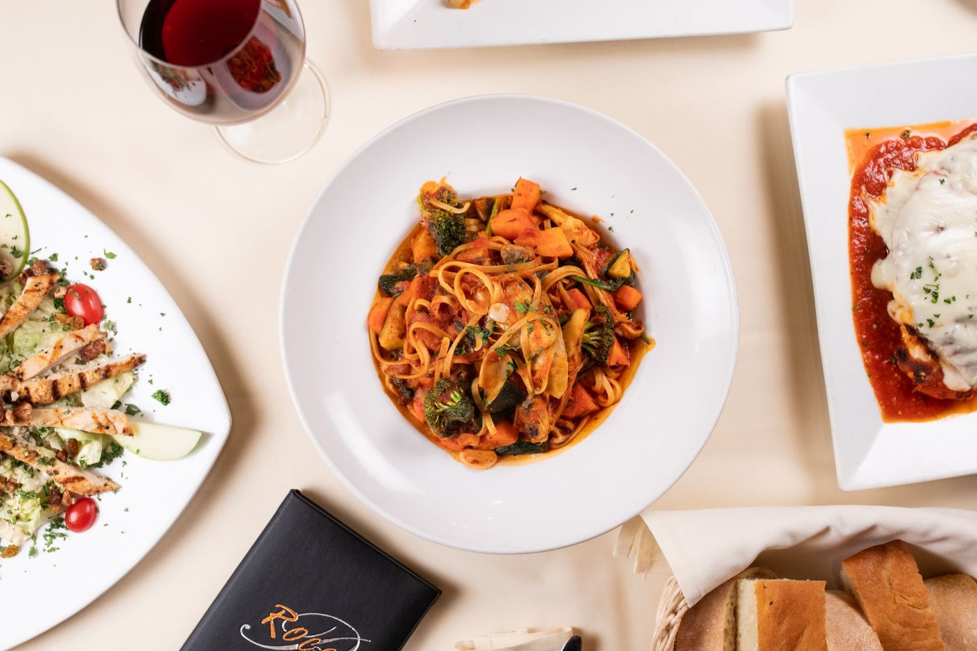 Lunch table with pasta, bread and wine